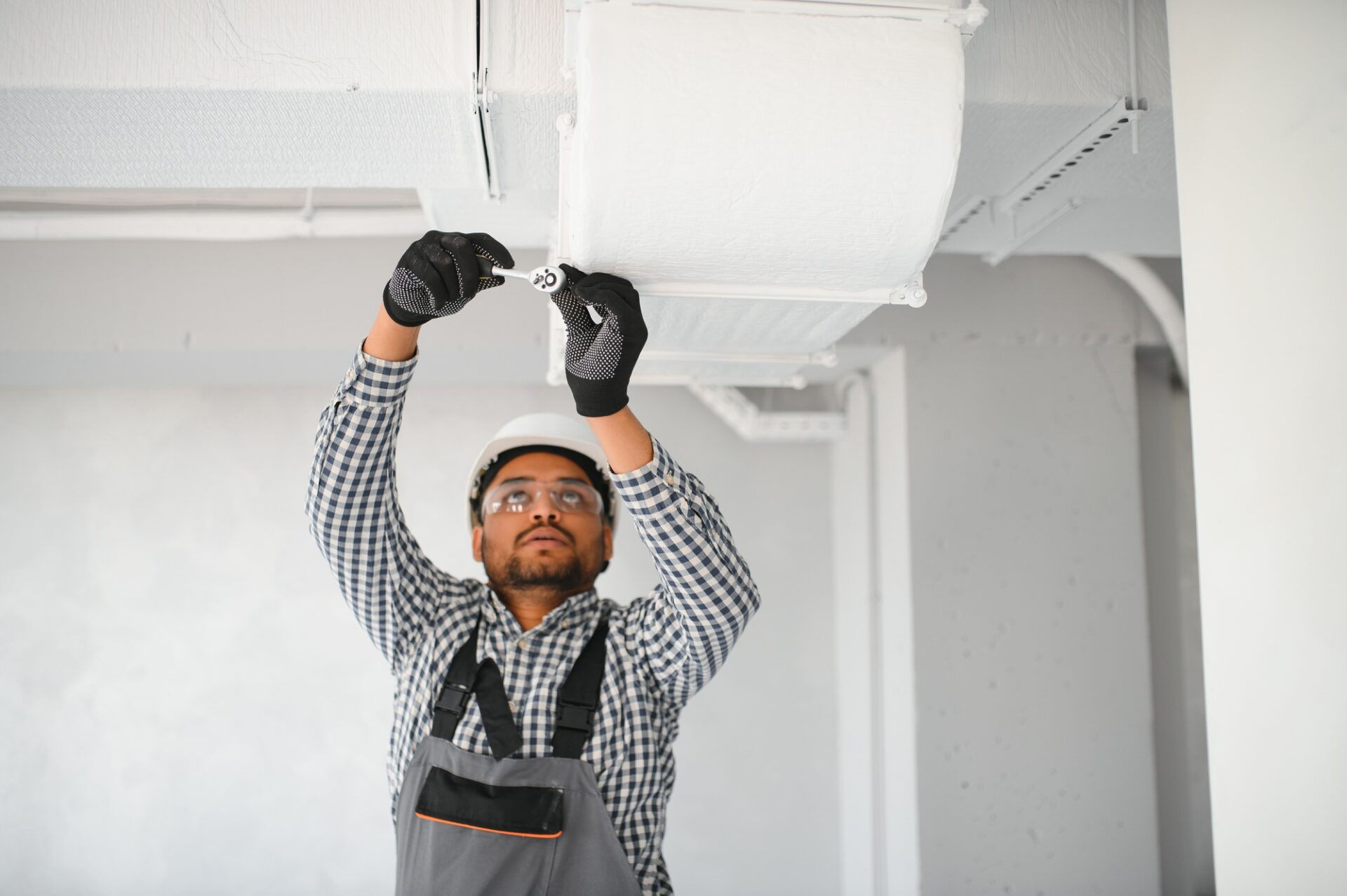 Ventilation cleaning. Specialist at work. Repair ventilation system HVAC. Industrial background